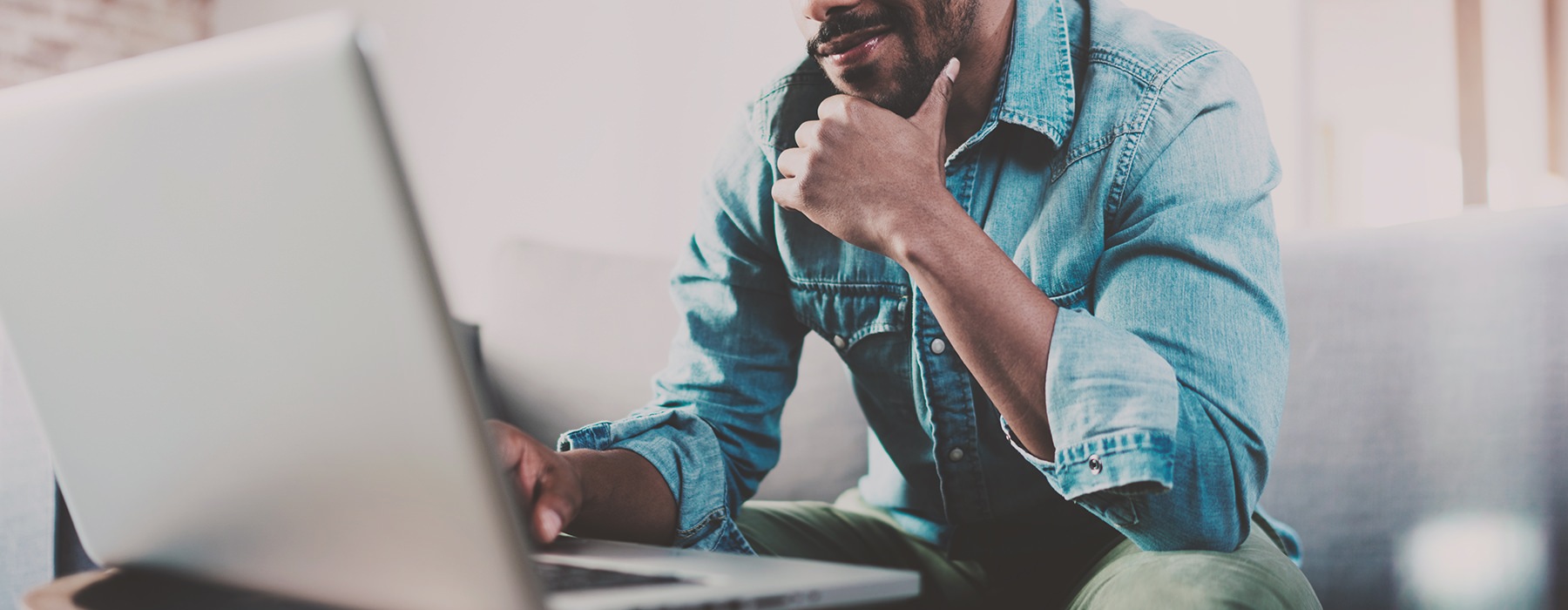 man sitting at a computer